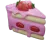 um bolo rosa com morangos nele