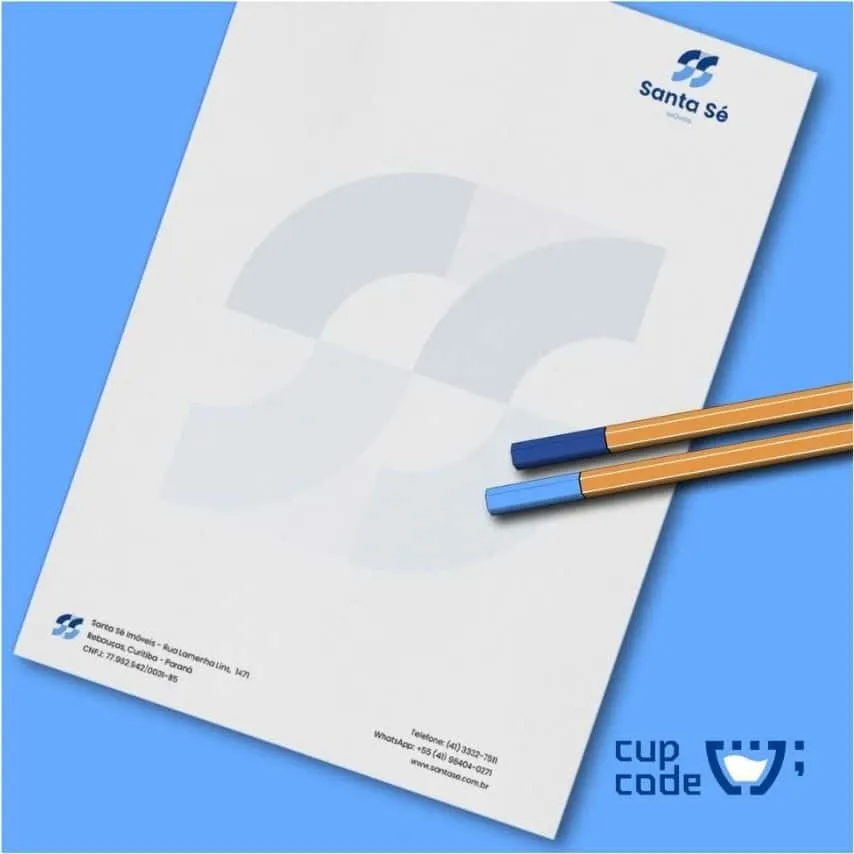 Papel timbrado com a logo da Santa Sé e duas canetas, com tampas azuis, claro e escuro.